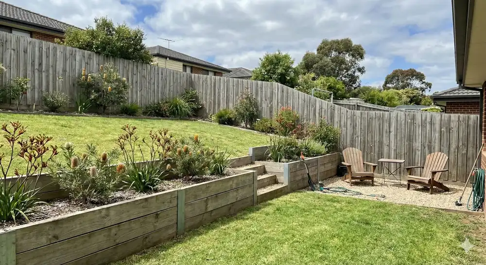 Common landscaping mistakes in Boronia Melbourne backyard with sloped lawn and raised garden beds
